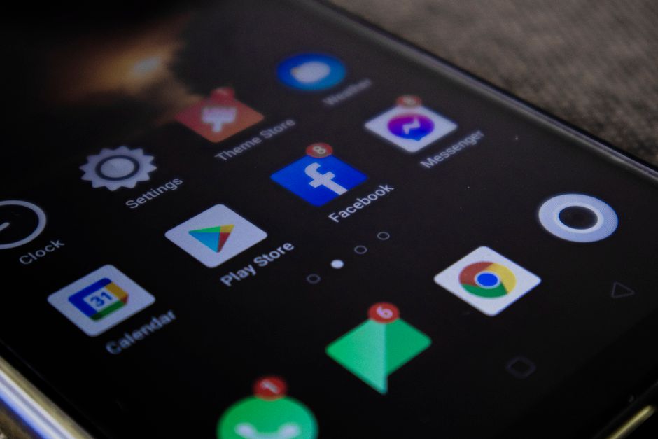 An Android phone screen showing two app marketplace icons side by side above a search bar